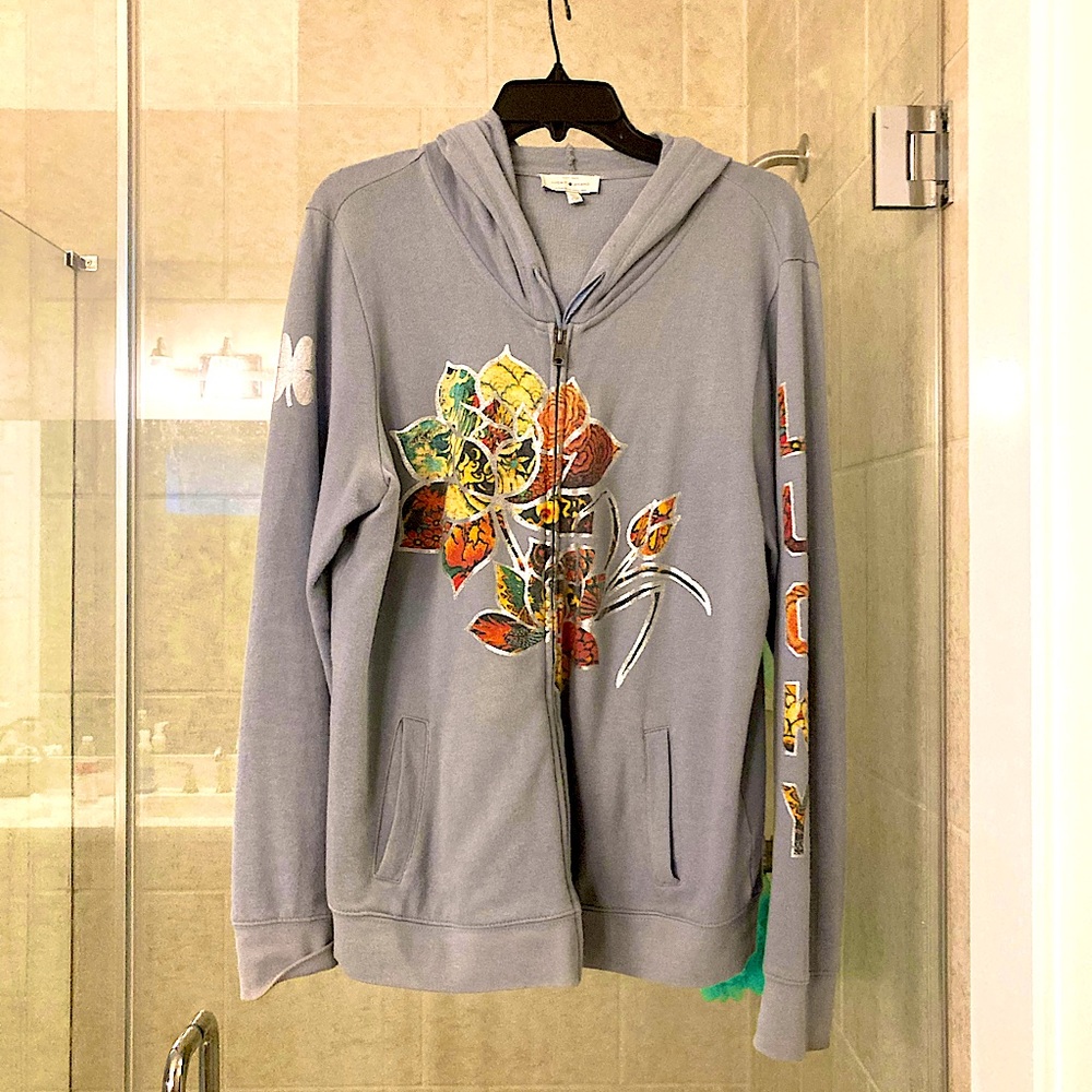 Lucky brand blue hoodie with colorful lettering on sleeve and front